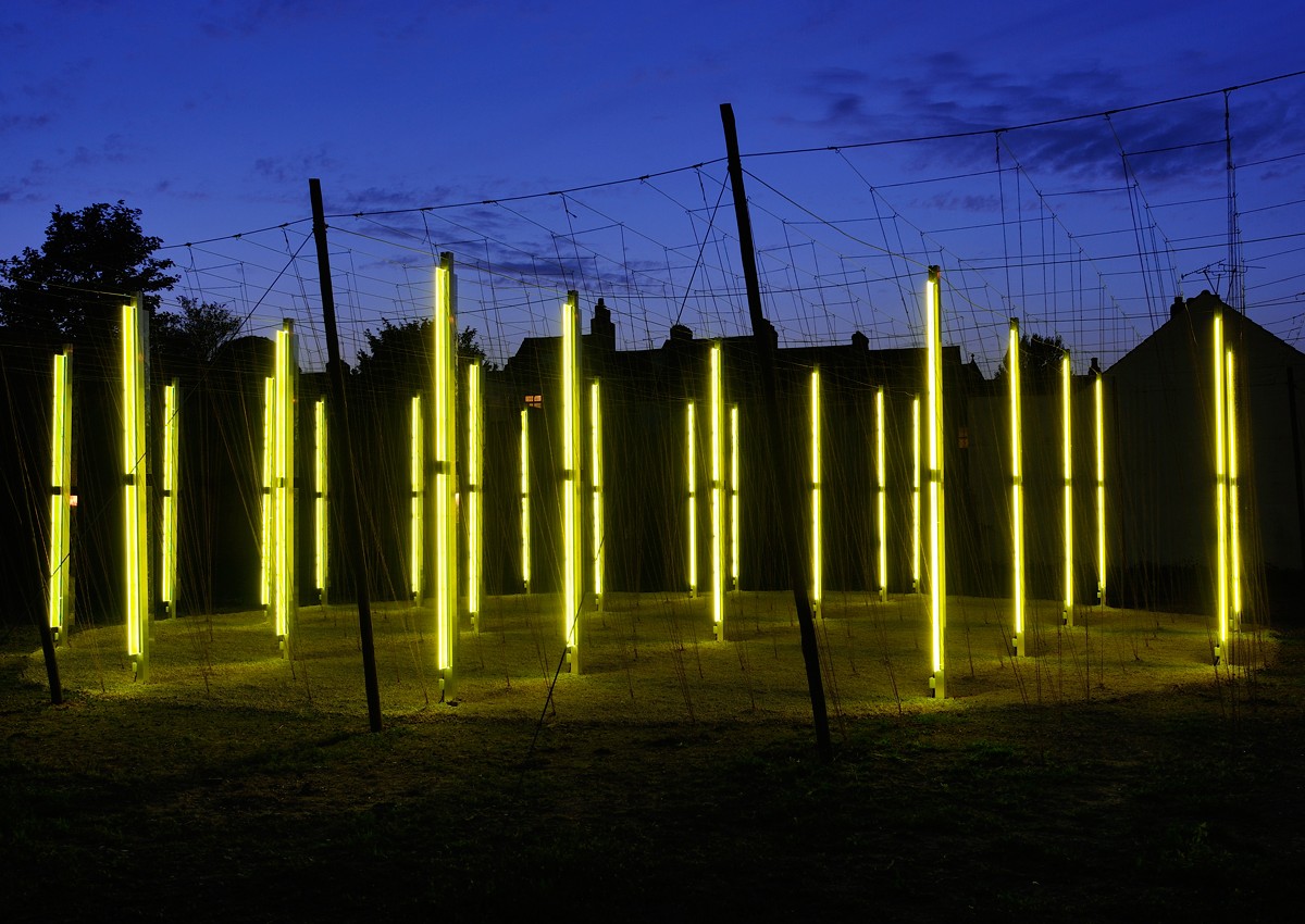 Jyll Bradley, Green/Light (For M.R.), 2014. Light sculpture  Timber poles, wire-work grid, aluminium poles with LED inset, plexiglass, mirrored acryclic, coir string, aggregate, steel anchorage, 22m x 22m
